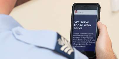 Forces Mutual picture of a Serving person reading their smartphone screen