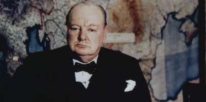 Image of Winston Churchill, presumably sat in the War Rooms ©IWM (Col 30)