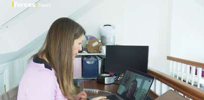 Image of Forces TV interviewer speaking to Helen Helliwell, Director of Armed Forces Policy, MOD.