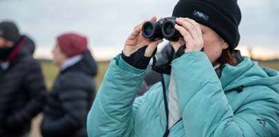 Lady with binoculars at RAF Honington Winter Warmer walk